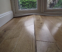 Wood floor being glued in Salisbury