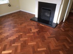 parquet herringbone flooring with cork strip replacement and repairs, sanded and sealed with Bona lacquer