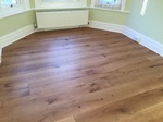 Supply and fit barn oak wood flooring wide oak planks in apartment in Bournemouth