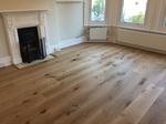 Supply and fit barn oak wood flooring wide oak planks in apartment in Bournemouth