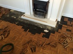 Mosaic parquet repairs to fireplace Shaftesbury