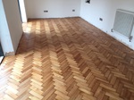 Reclaimed wood flooring pine parquet installed in herringbone style, sanding and finish in Southampton