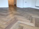 Large engineered oak parquet with a grey oiled finish. Installed in Winchester 