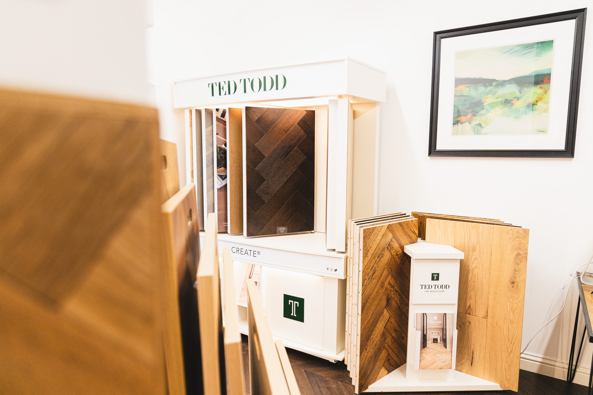 Wood floor showroom in salisbury with flooring samples close up and in a rack.