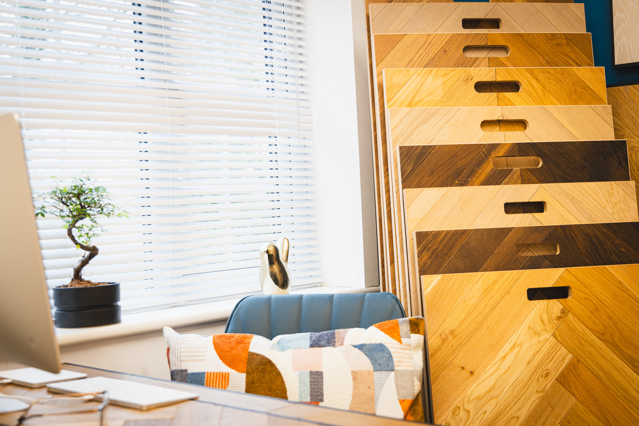 Artistic shot of desk area in showroom with some wood floor samples.