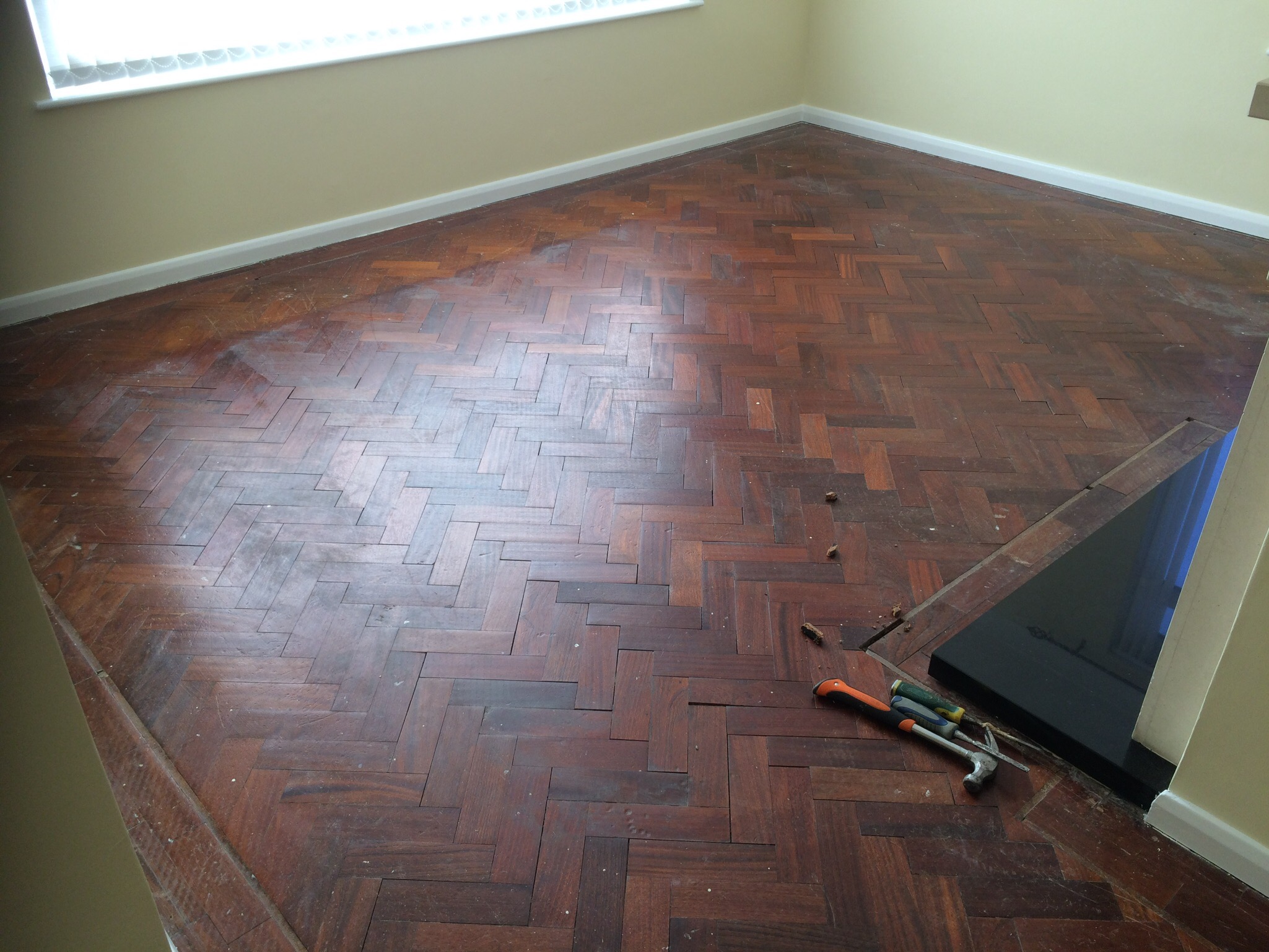 parquet herringbone flooring with cork strip replacement and repairs, sanded and sealed with Bona lacquer