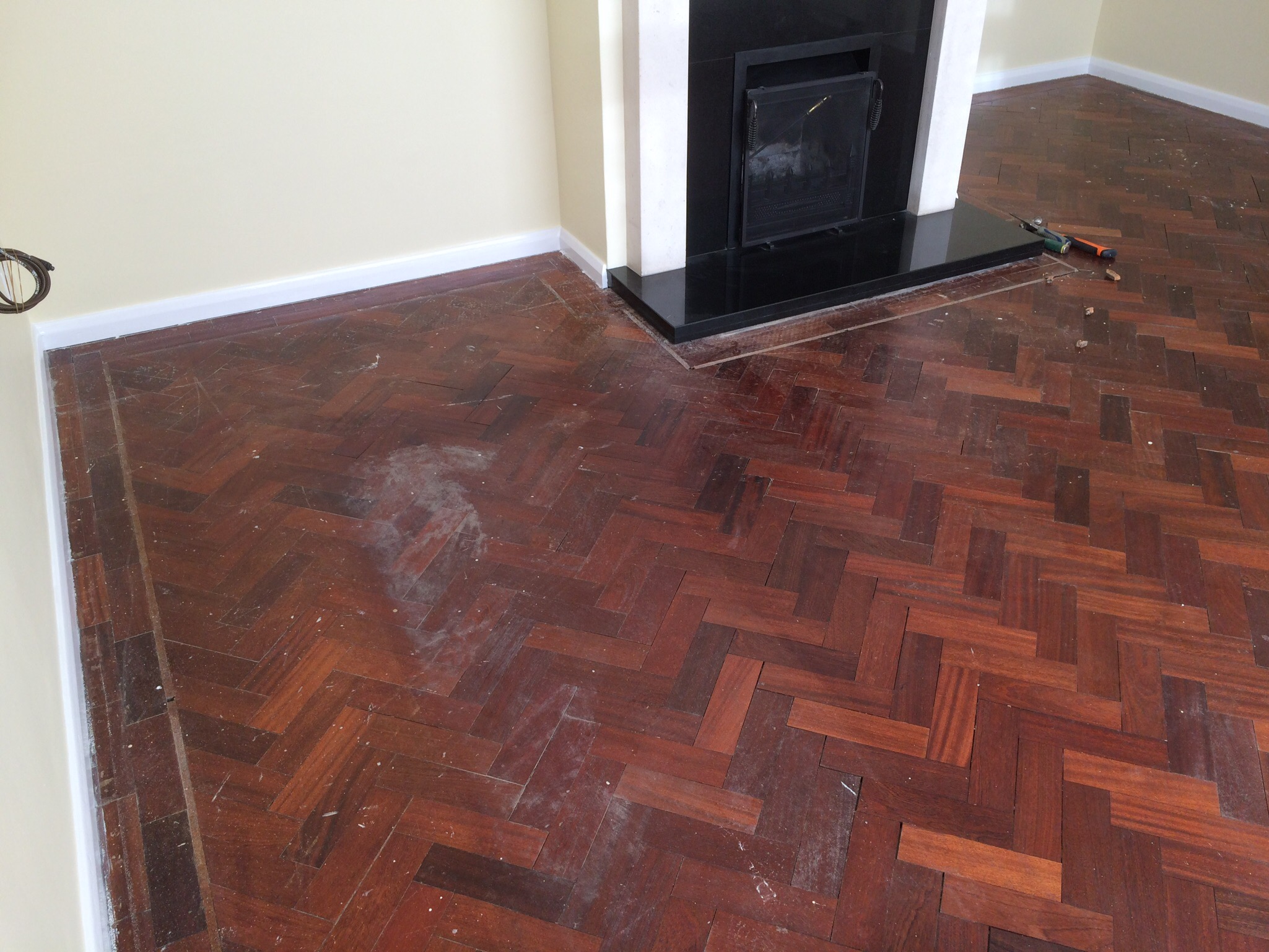 parquet herringbone flooring with cork strip replacement and repairs, sanded and sealed with Bona lacquer