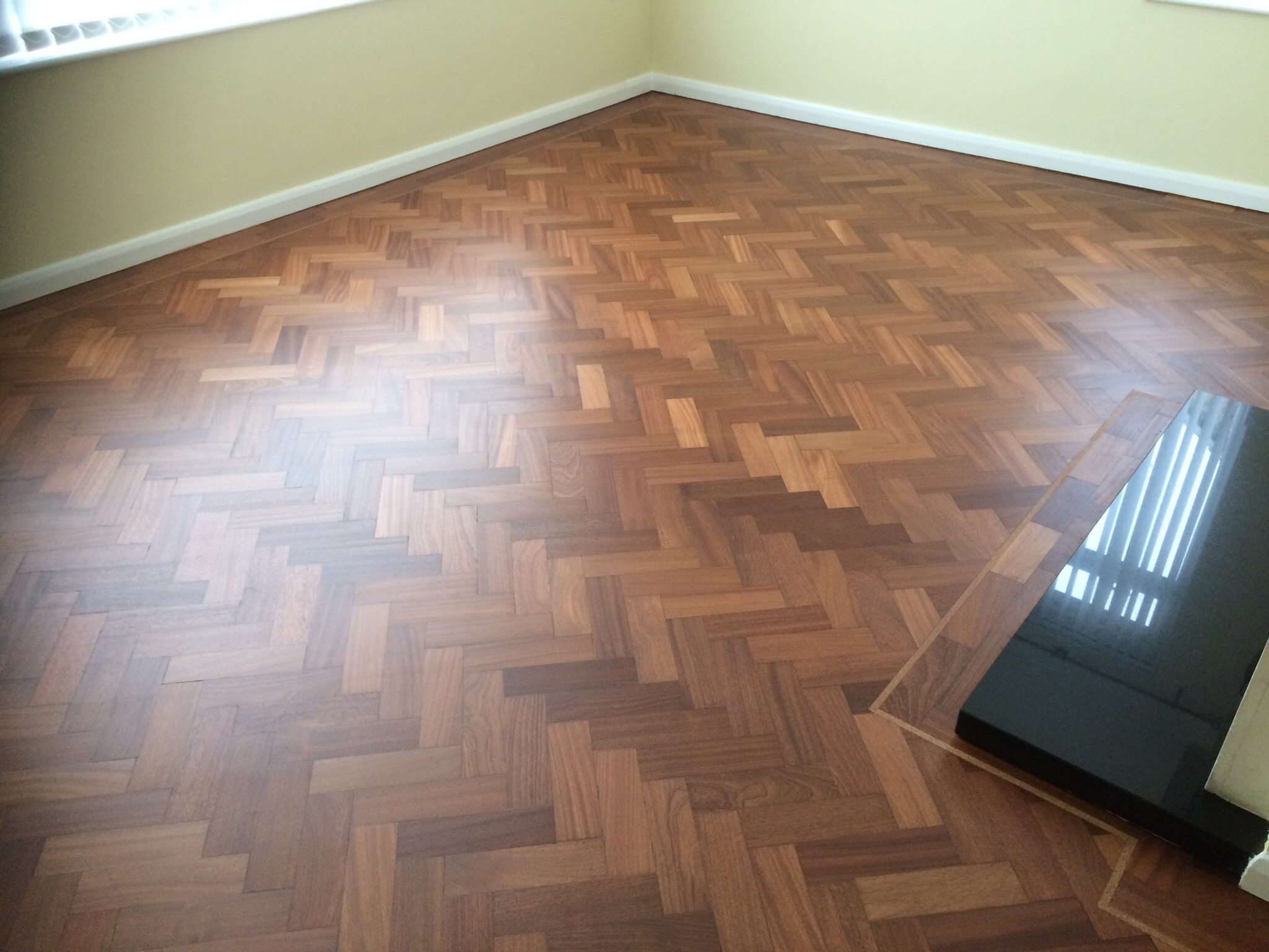parquet herringbone flooring with cork strip replacement and repairs, sanded and sealed with Bona lacquer