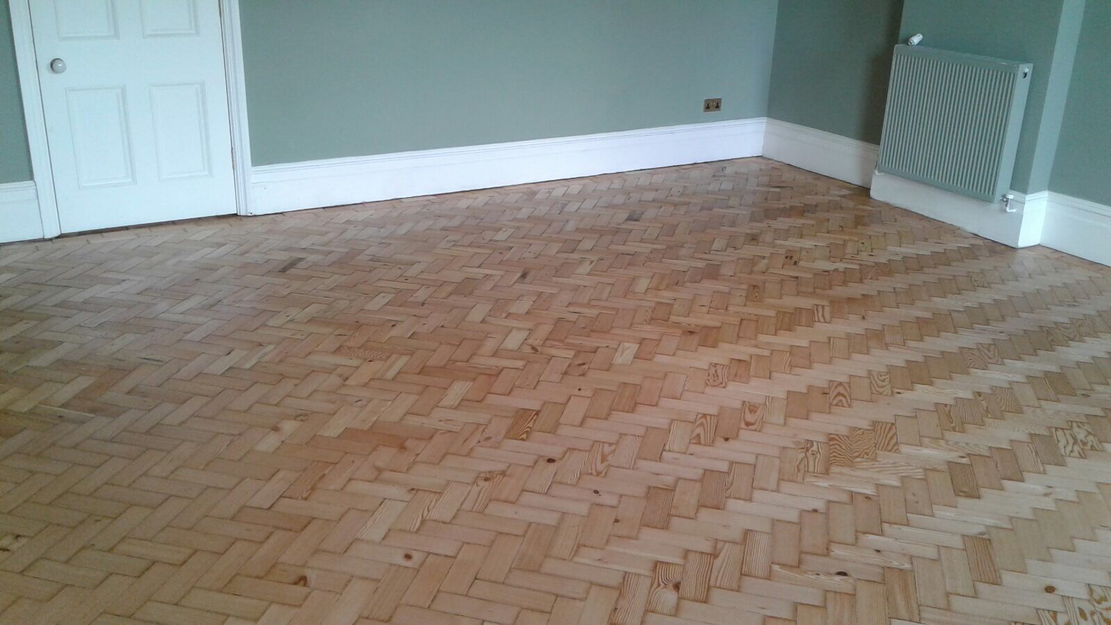 Reclaimed herringbone to match existing parquet pine installed sanded and repaired in Shaftesbury