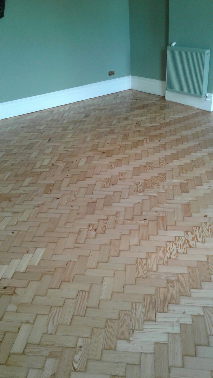Reclaimed herringbone to match existing parquet pine installed sanded and repaired in Shaftesbury