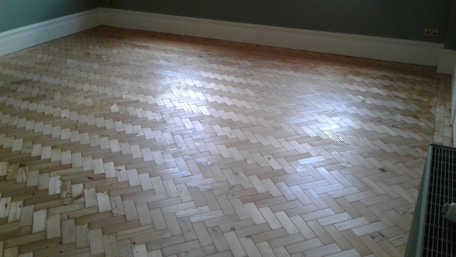 Reclaimed herringbone to match existing parquet pine installed sanded and repaired in Shaftesbury