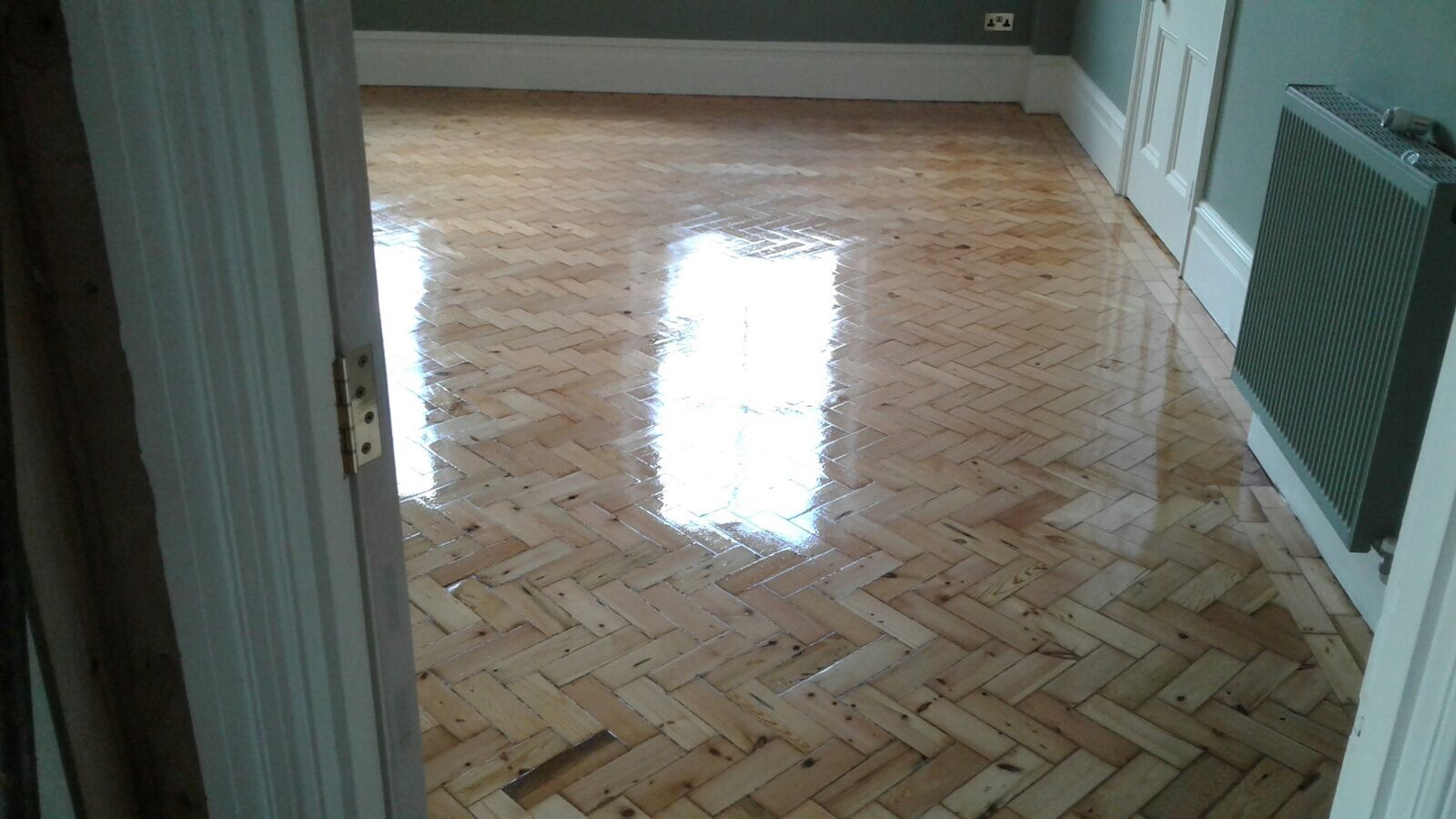 Reclaimed herringbone to match existing parquet pine installed sanded and repaired in Shaftesbury