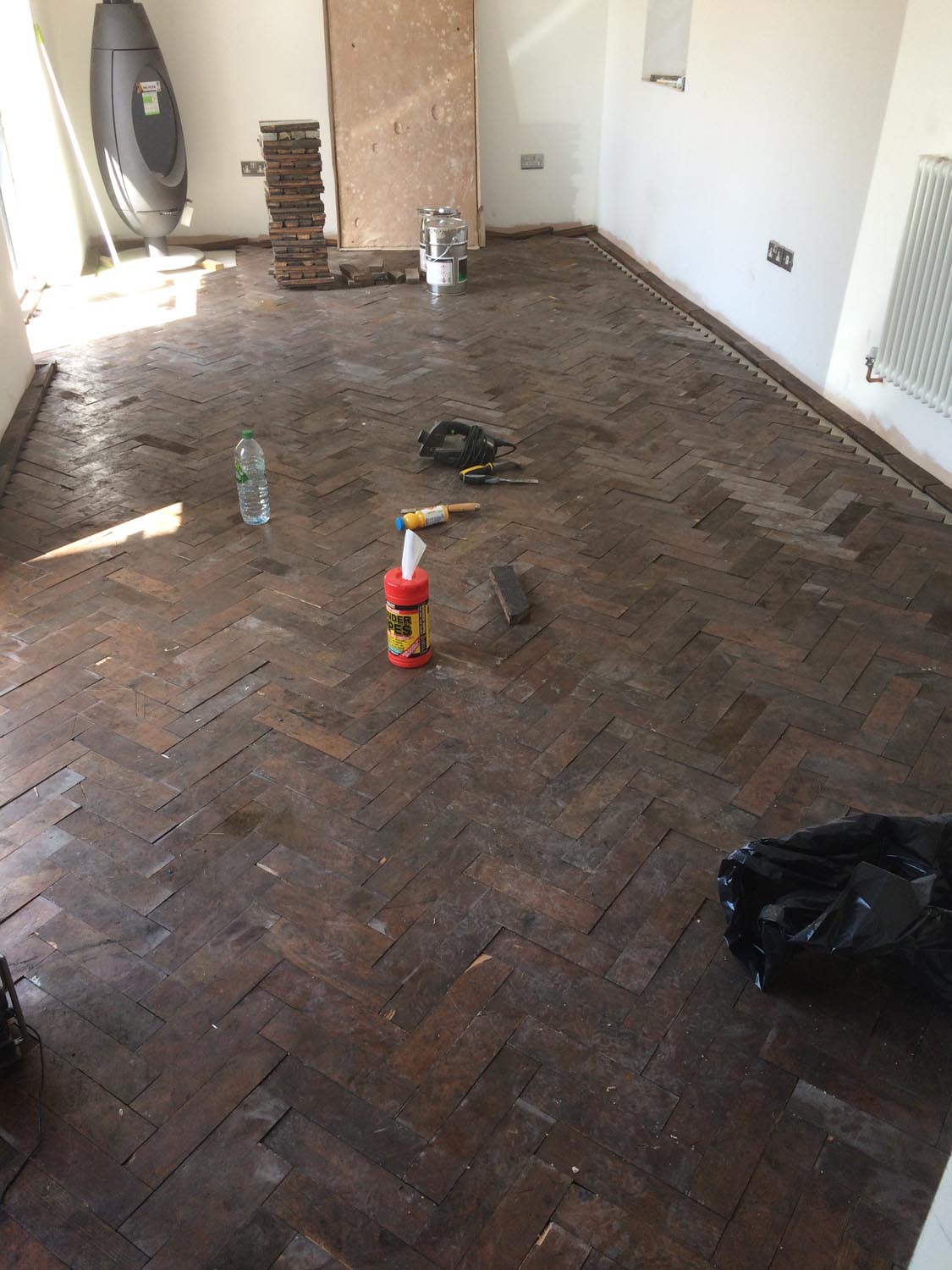 Reclaimed wood flooring pine parquet installed in herringbone style, sanding and finish in Southampton