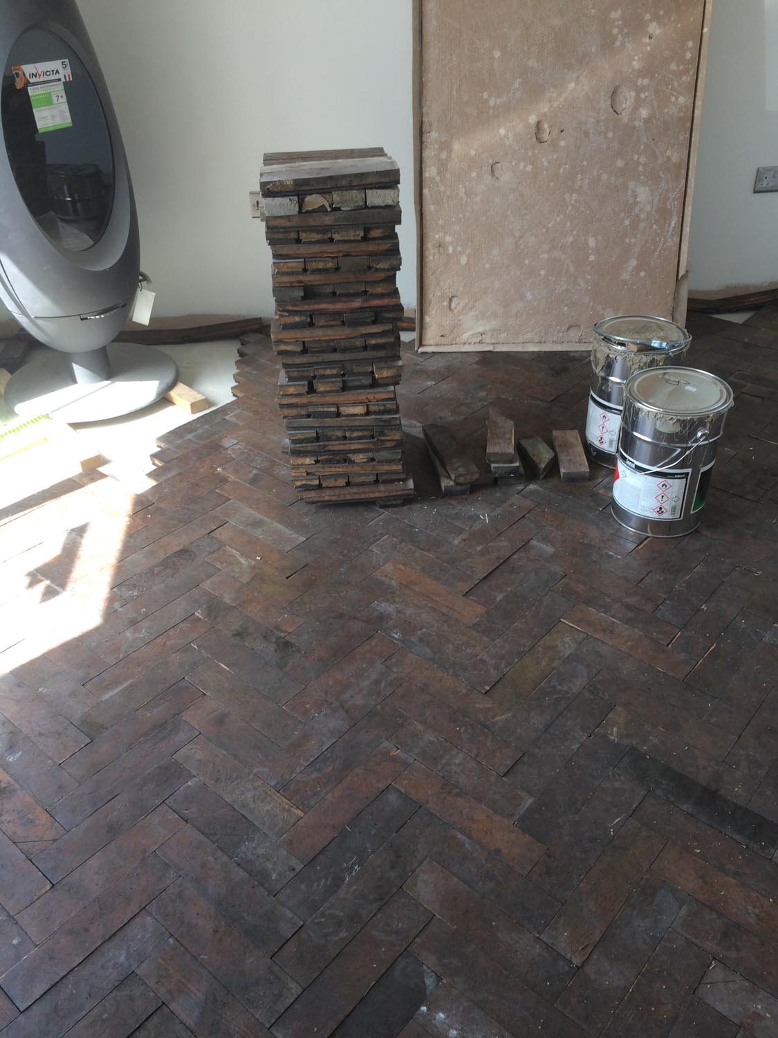 Reclaimed wood flooring pine parquet installed in herringbone style, sanding and finish in Southampton