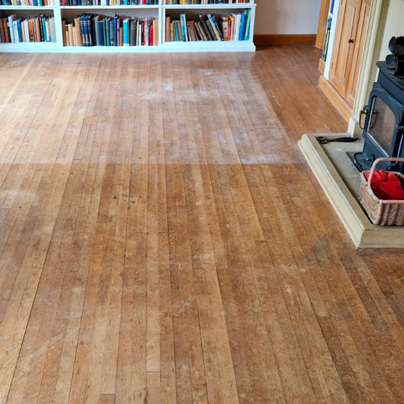 Floorboards in living room before they have been sanded.