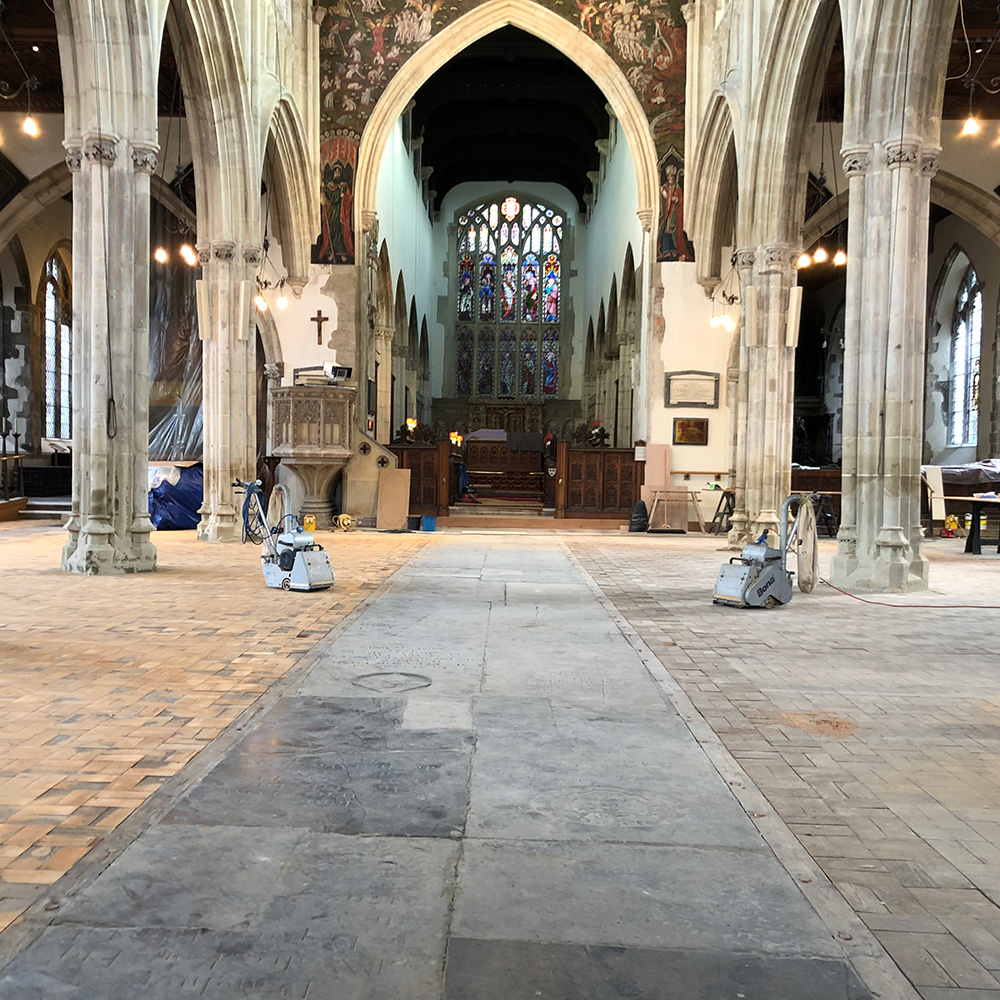 St thomas's church wood floor midway way being commercially sanded.