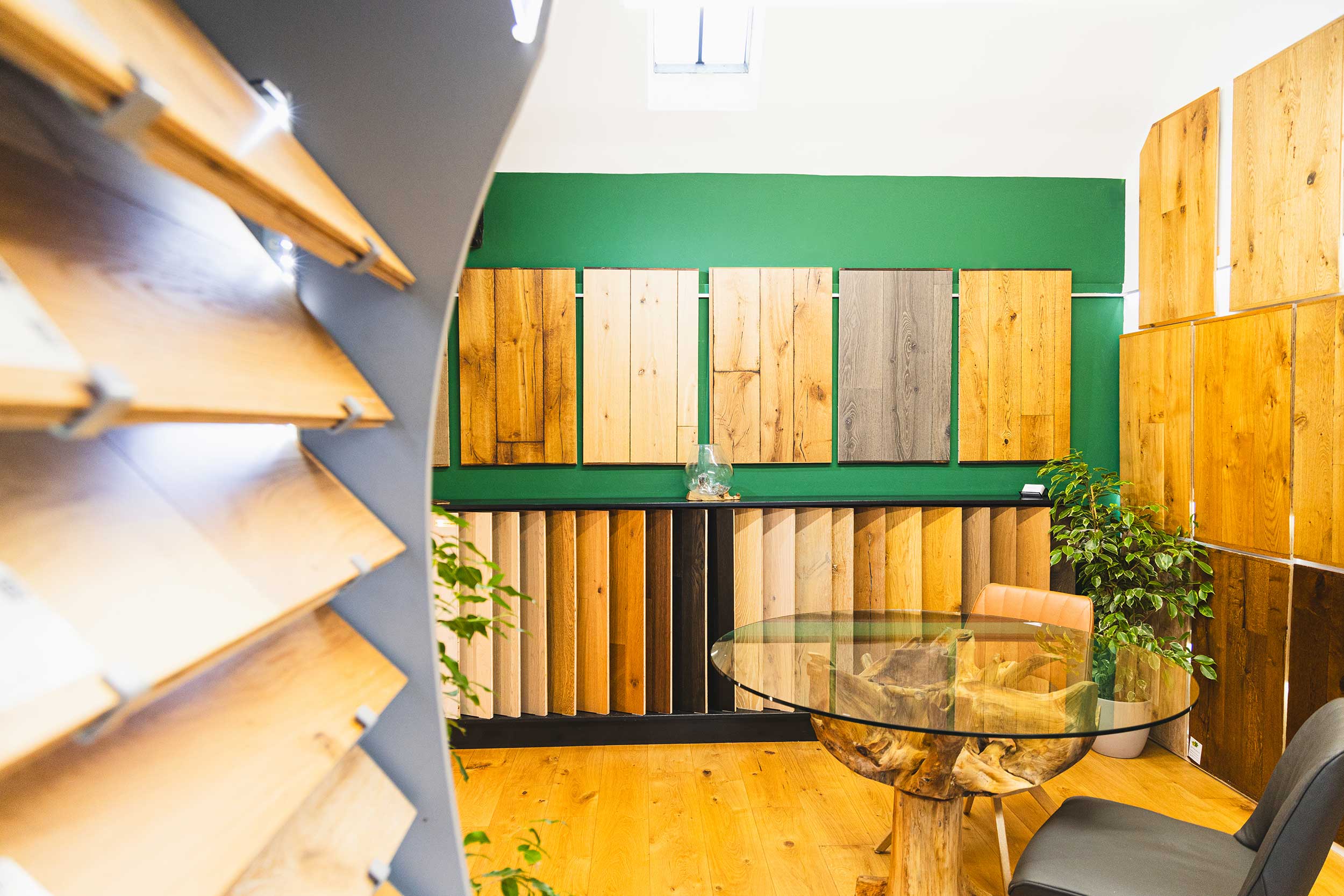 Showroom with lots of wood samples on the wall and up close.