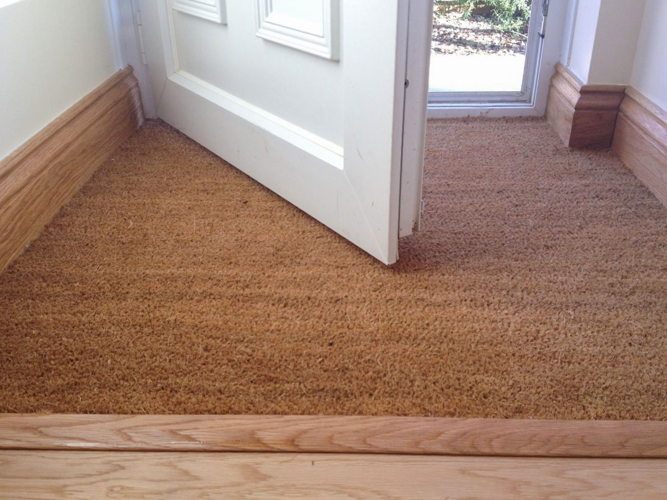 Close up of inset coir matt installed at front of home.