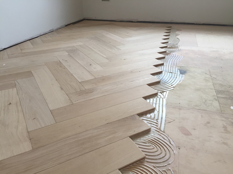 Engineered oak large parquet block wood flooring installed over underfloor heating
