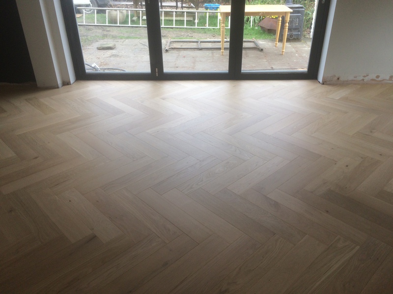 Engineered oak large parquet block wood flooring installed over underfloor heating