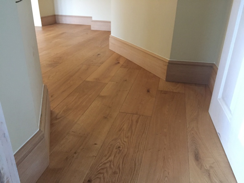 brushed and oiled oak flooring with new oak skirting - Codford