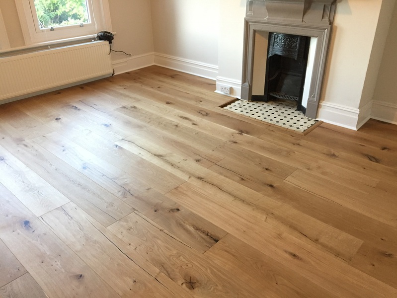 Supply and fit barn oak wood flooring wide oak planks in apartment in Bournemouth