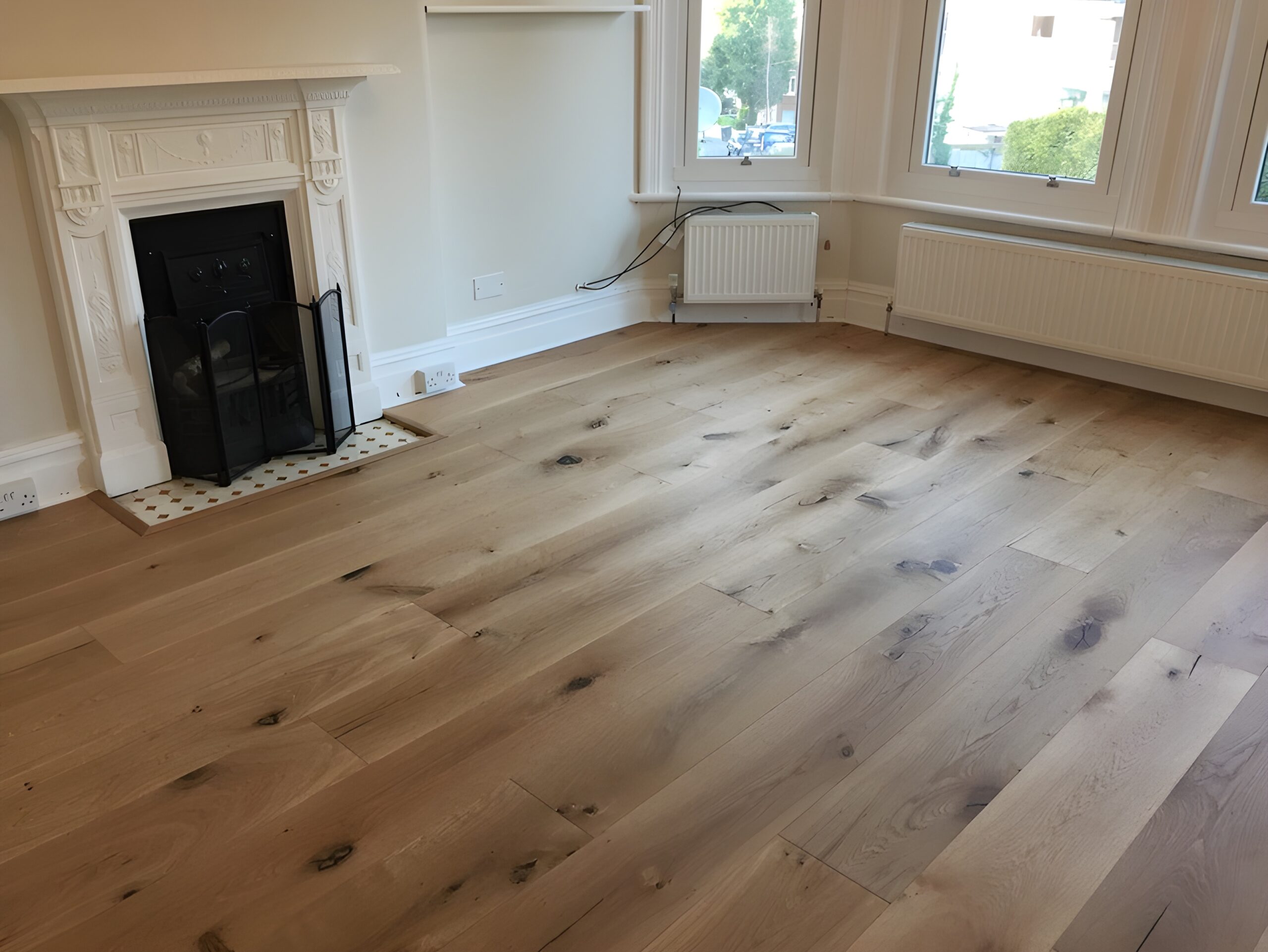 Supply and fit barn oak wood flooring wide oak planks in apartment in Bournemouth