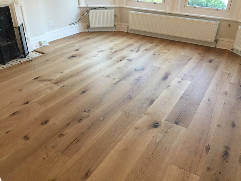 Supply and fit barn oak wood flooring wide oak planks in apartment in Bournemouth