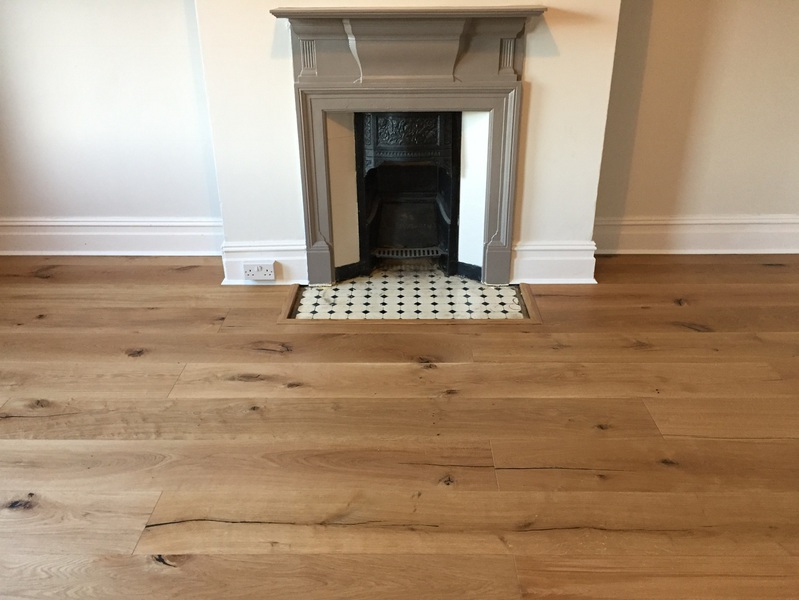 Supply and fit barn oak wood flooring wide oak planks in apartment in Bournemouth