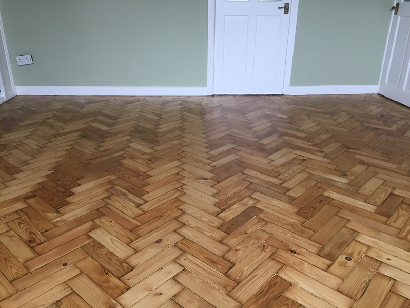 loose pine parquet blocks that needed to be re-stuck before sanding, sanded and finished with Bona Lacquer Ringwood