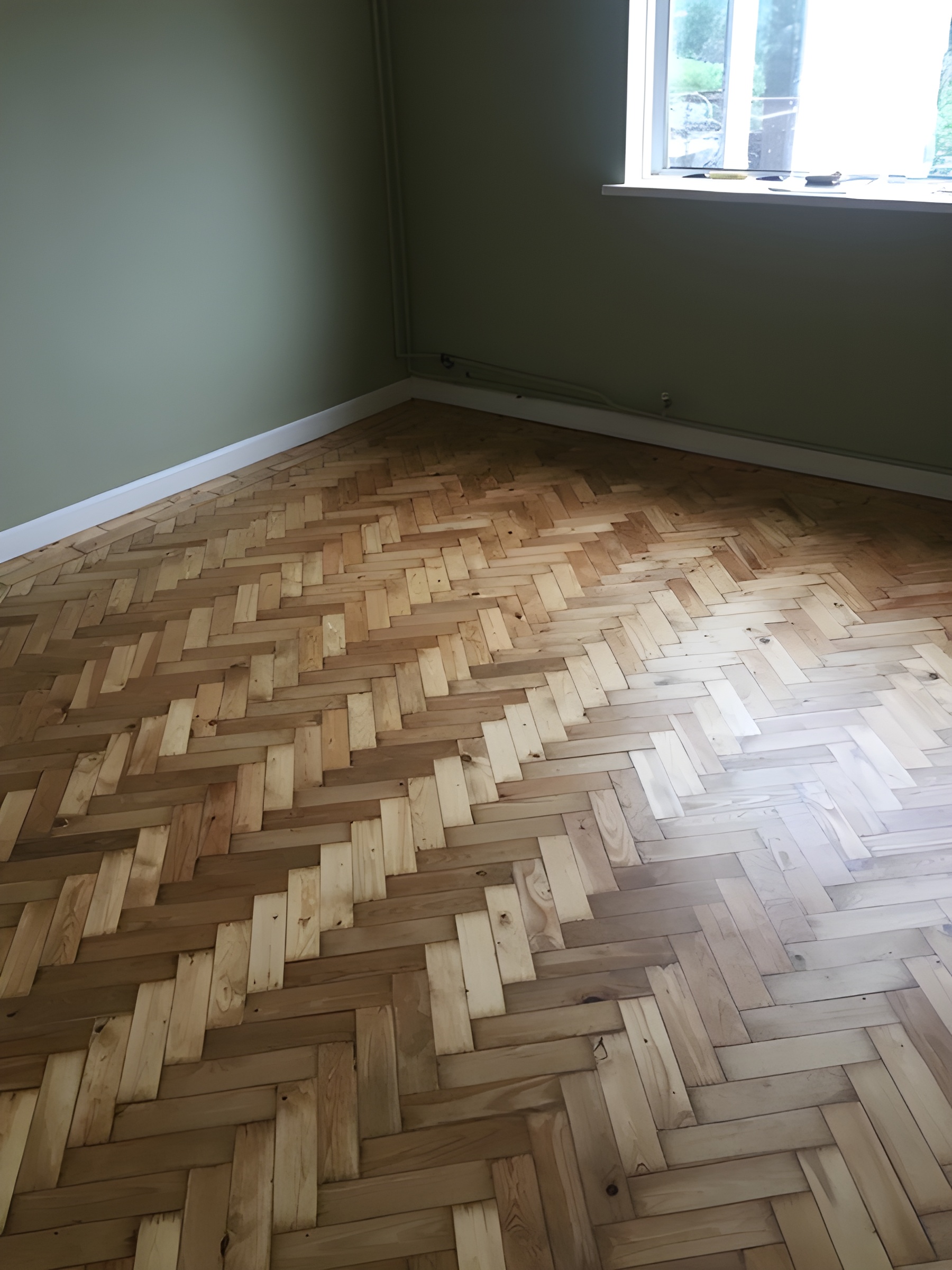 loose pine parquet blocks that needed to be re-stuck before sanding, sanded and finished with Bona Lacquer Ringwood