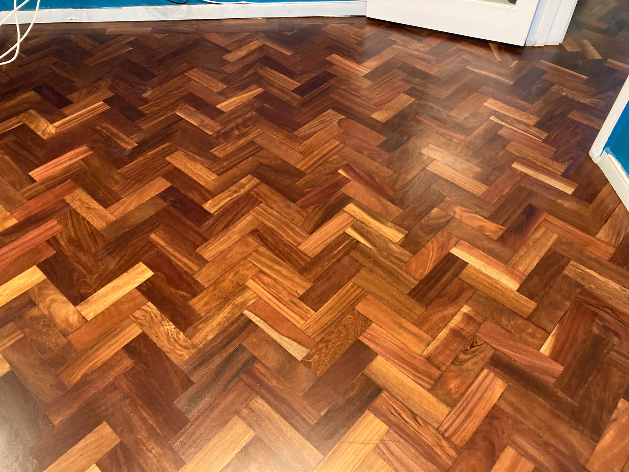 African Mahogany (Sapele) Herringbone Parquet Restoration, Andover